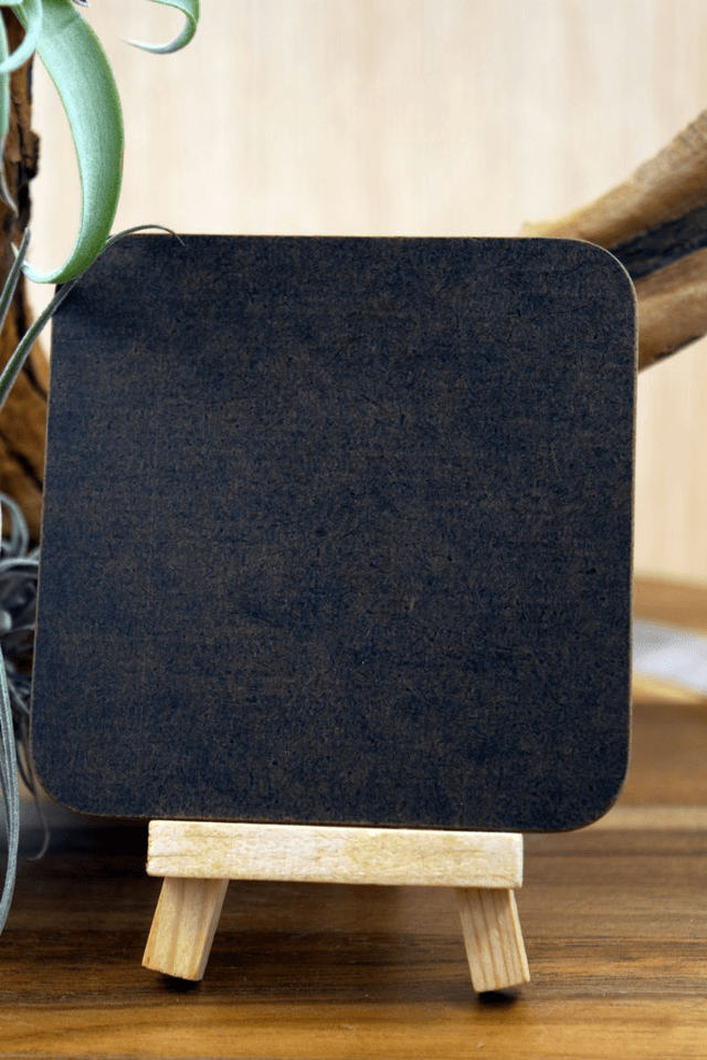 Square Coaster: Adorable Bear Cub Nestled in Lush Foliage Design